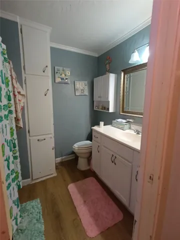 a spacious bathroom with a granite countertop sink toilet and shower
