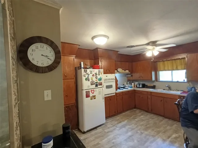 a kitchen with cabinets and window