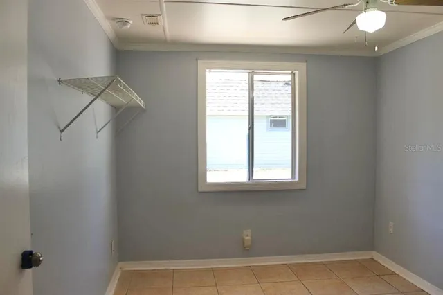 a view of a room that has a window in it