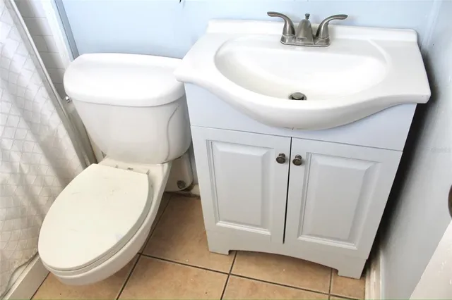 a bathroom with a toilet and a sink