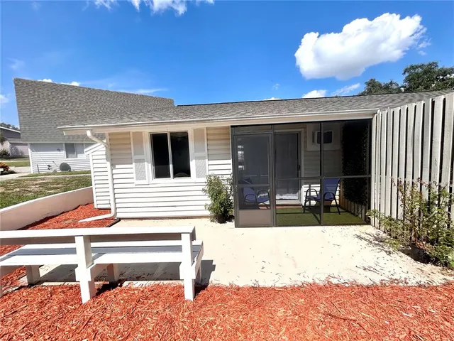 a view of a swimming pool with a yard