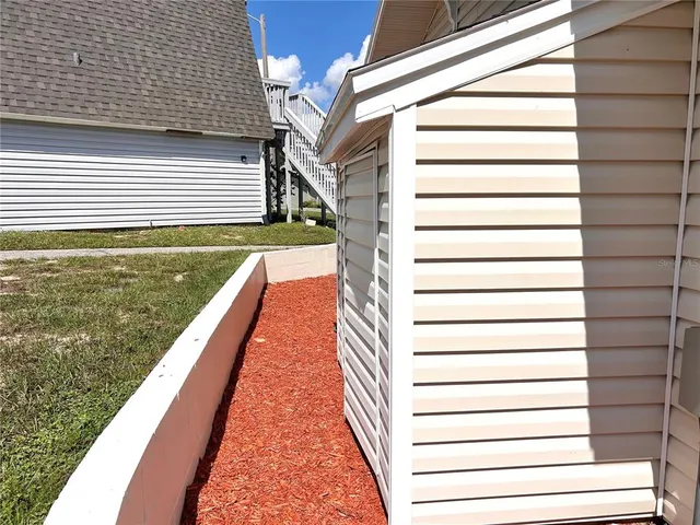 a view of a sitting area with furniture and garden