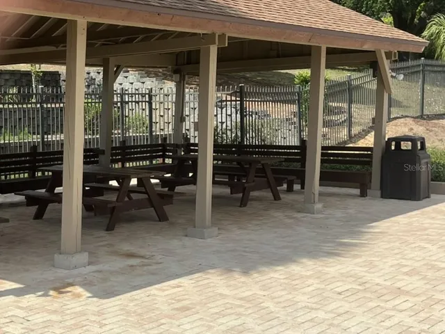 a view of a balcony with wooden floor