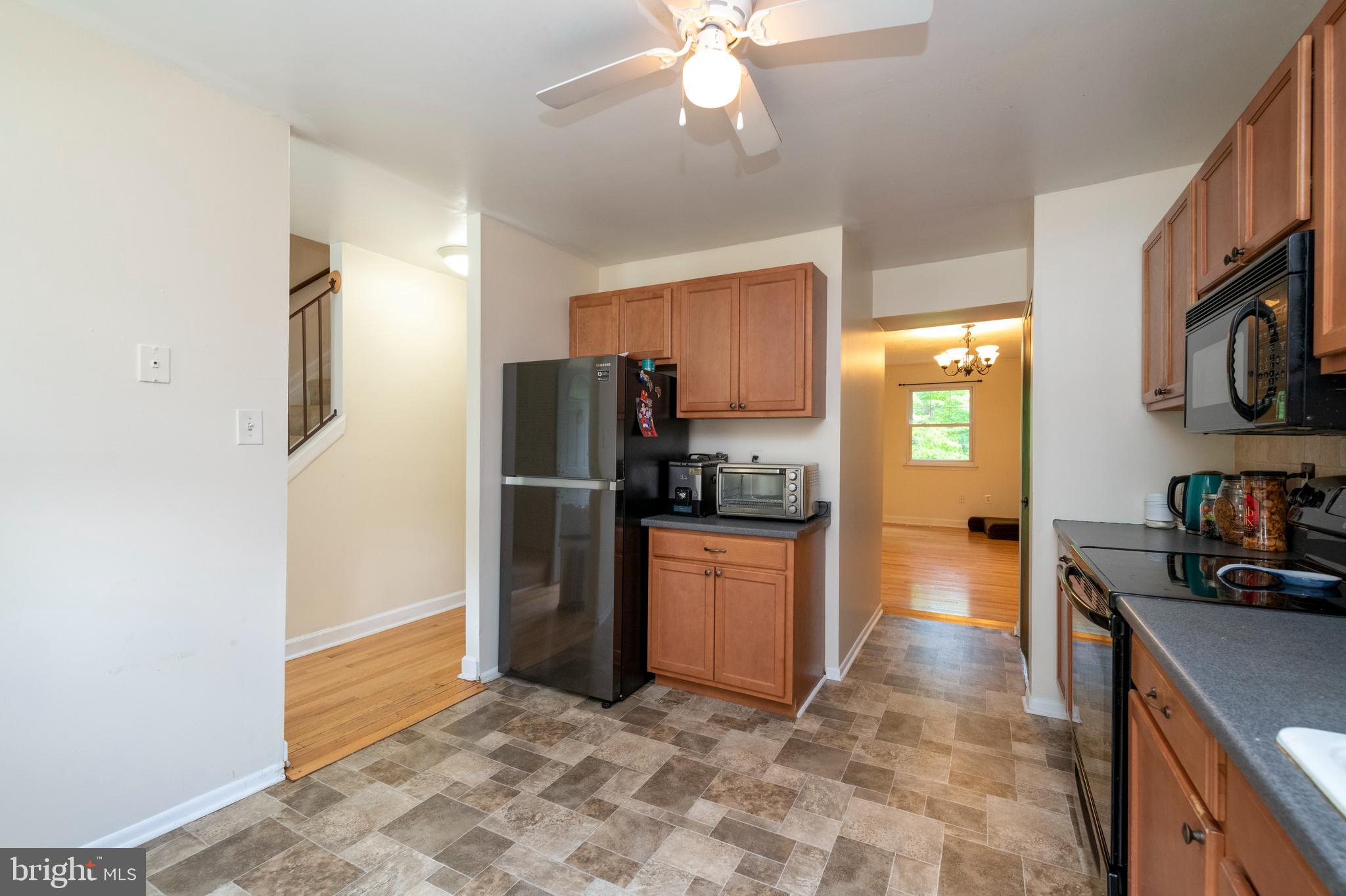 9376 Pan Ridge Road, Unit 9376 Parkville, MD 21234 - Photo 7 of 32 Kitchen opens up to dining room and living room