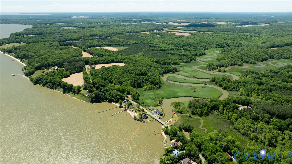 933 Pleasant Point Road Surry, VA 23883 - Photo 45 of 45 an aerial view of green landscape with trees houses and mountain view