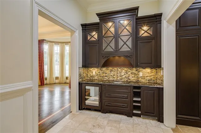 a kitchen with stainless steel appliances granite countertop a stove and a sink