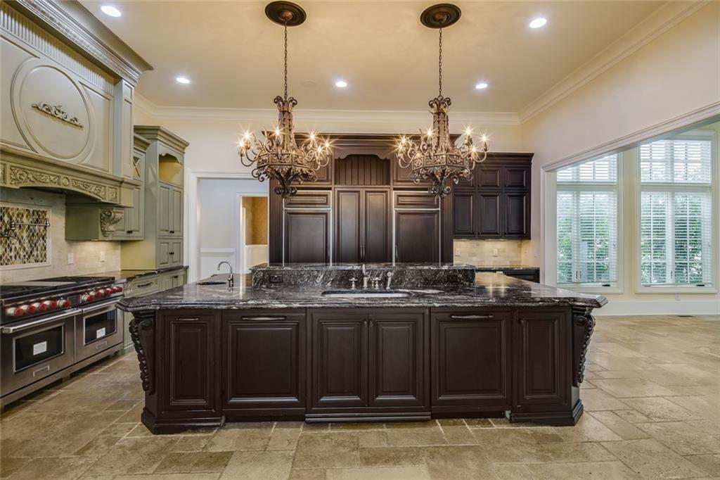 35 Mt Paran Road Northwest Sandy Springs, GA 30327 - Photo 12 of 61 a kitchen with a stove and a chandelier