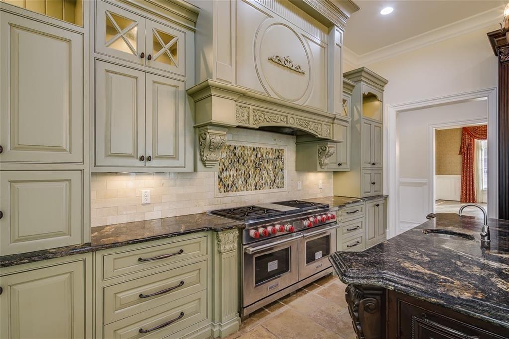 35 Mt Paran Road Northwest Sandy Springs, GA 30327 - Photo 14 of 61 a kitchen with stainless steel appliances granite countertop a stove and a sink