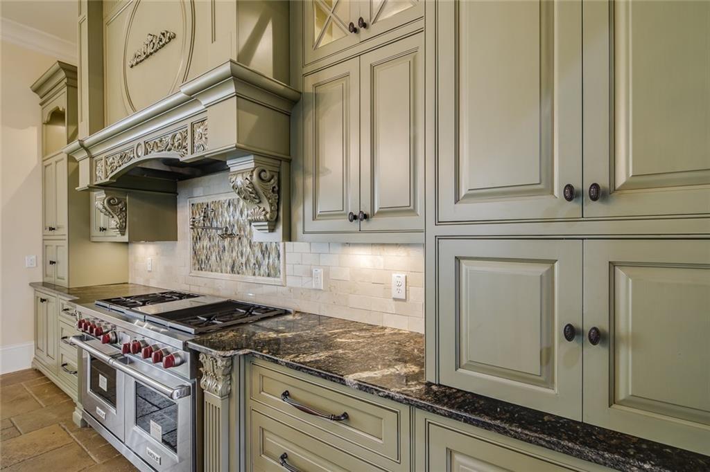 35 Mt Paran Road Northwest Sandy Springs, GA 30327 - Photo 15 of 61 a kitchen with stainless steel appliances granite countertop a stove and a microwave