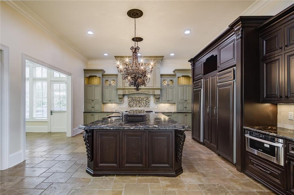 35 Mt Paran Road Northwest Sandy Springs, GA 30327 - Photo 16 of 61 a kitchen with stainless steel appliances granite countertop a sink and a refrigerator