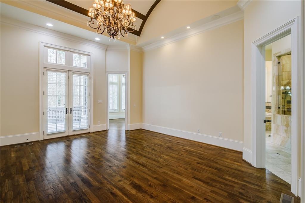 35 Mt Paran Road Northwest Sandy Springs, GA 30327 - Photo 22 of 61 a view of an empty room with wooden floor and a window