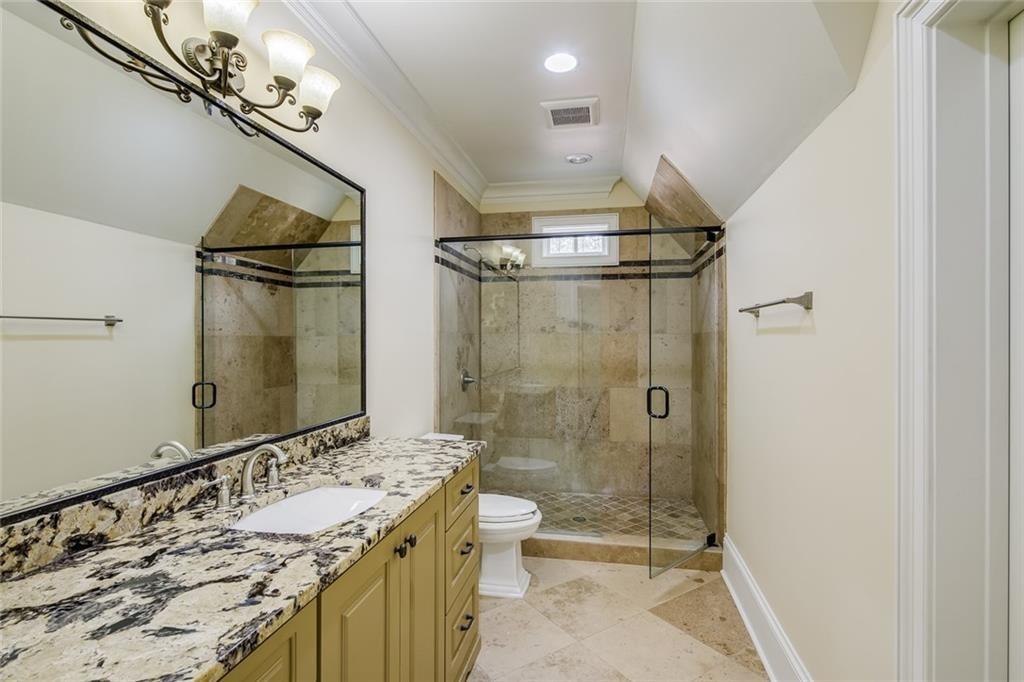 35 Mt Paran Road Northwest Sandy Springs, GA 30327 - Photo 31 of 61 a bathroom with a granite countertop sink a toilet and shower