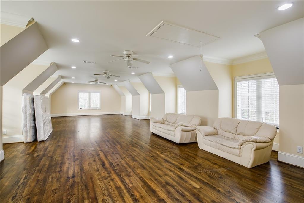 35 Mt Paran Road Northwest Sandy Springs, GA 30327 - Photo 37 of 61 a living room with couches and a coffee table with wooden floor