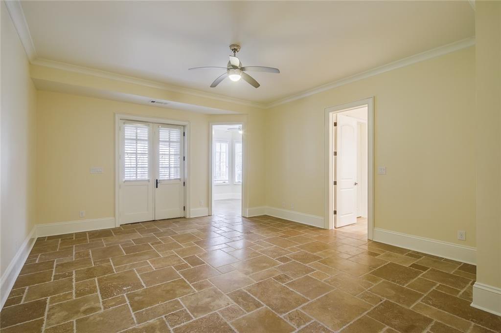35 Mt Paran Road Northwest Sandy Springs, GA 30327 - Photo 41 of 61 a view of an empty room with window and chandelier fan