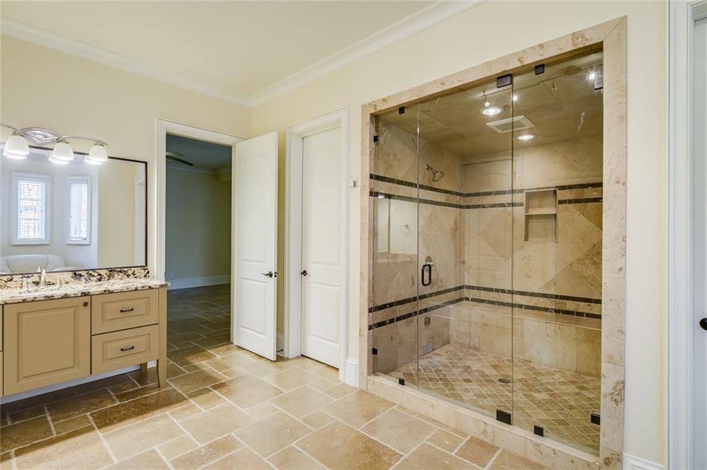 35 Mt Paran Road Northwest Sandy Springs, GA 30327 - Photo 43 of 61 a bathroom with a glass shower door and a sink
