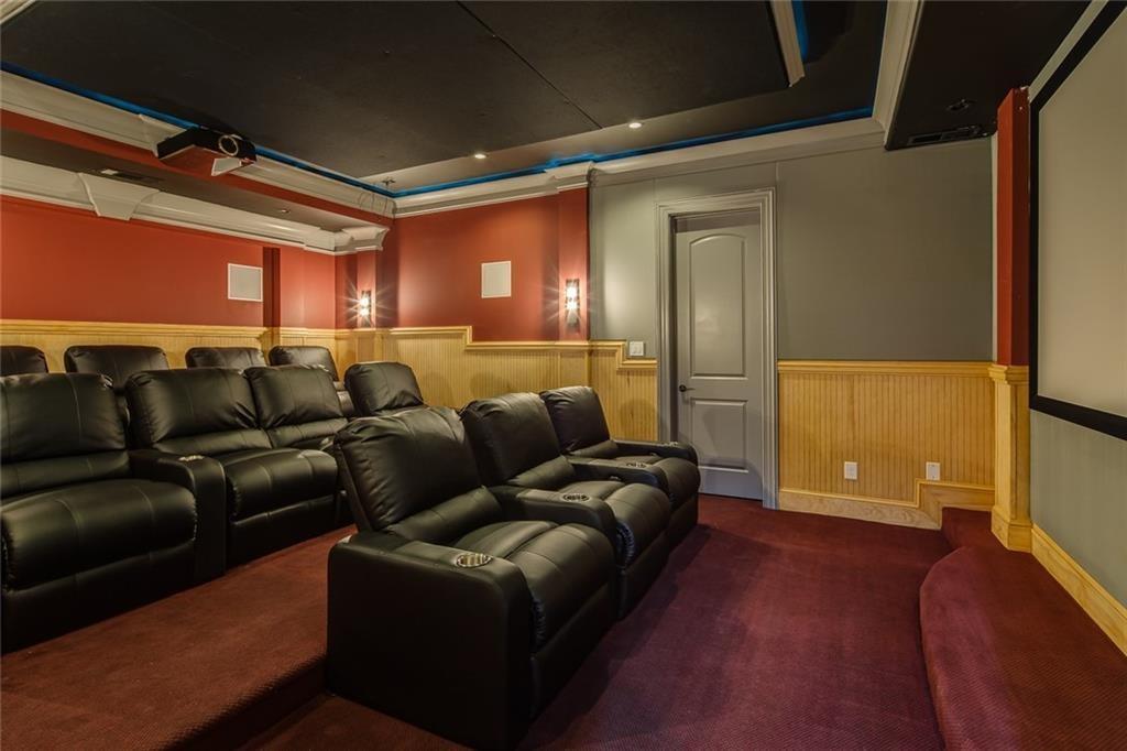 35 Mt Paran Road Northwest Sandy Springs, GA 30327 - Photo 48 of 61 a media room with lots of chairs and a projector
