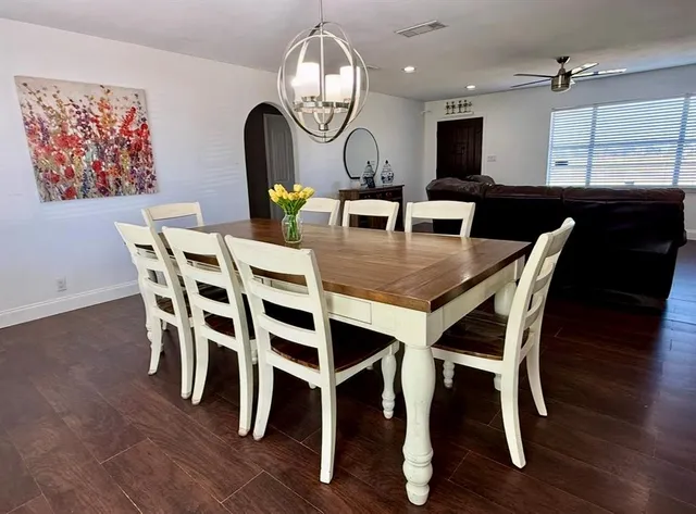 a view of a dining room with furniture and wooden floor