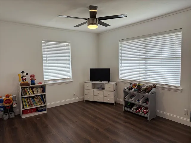 a living room with furniture window and a flat screen tv