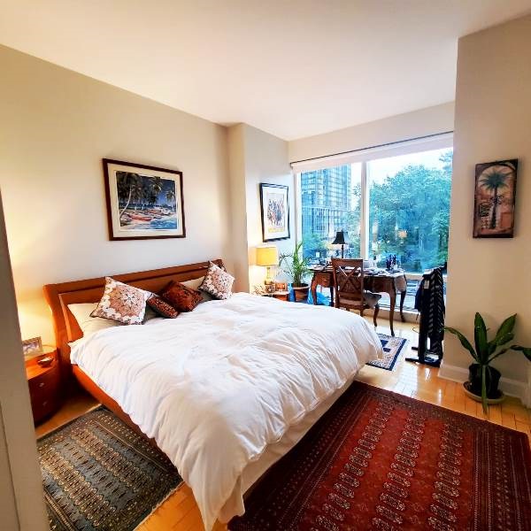 845 United Nations Plaza, Unit 5D Manhattan, NY 10017 - Photo 11 of 28 a bed sitting in a bedroom next to a window