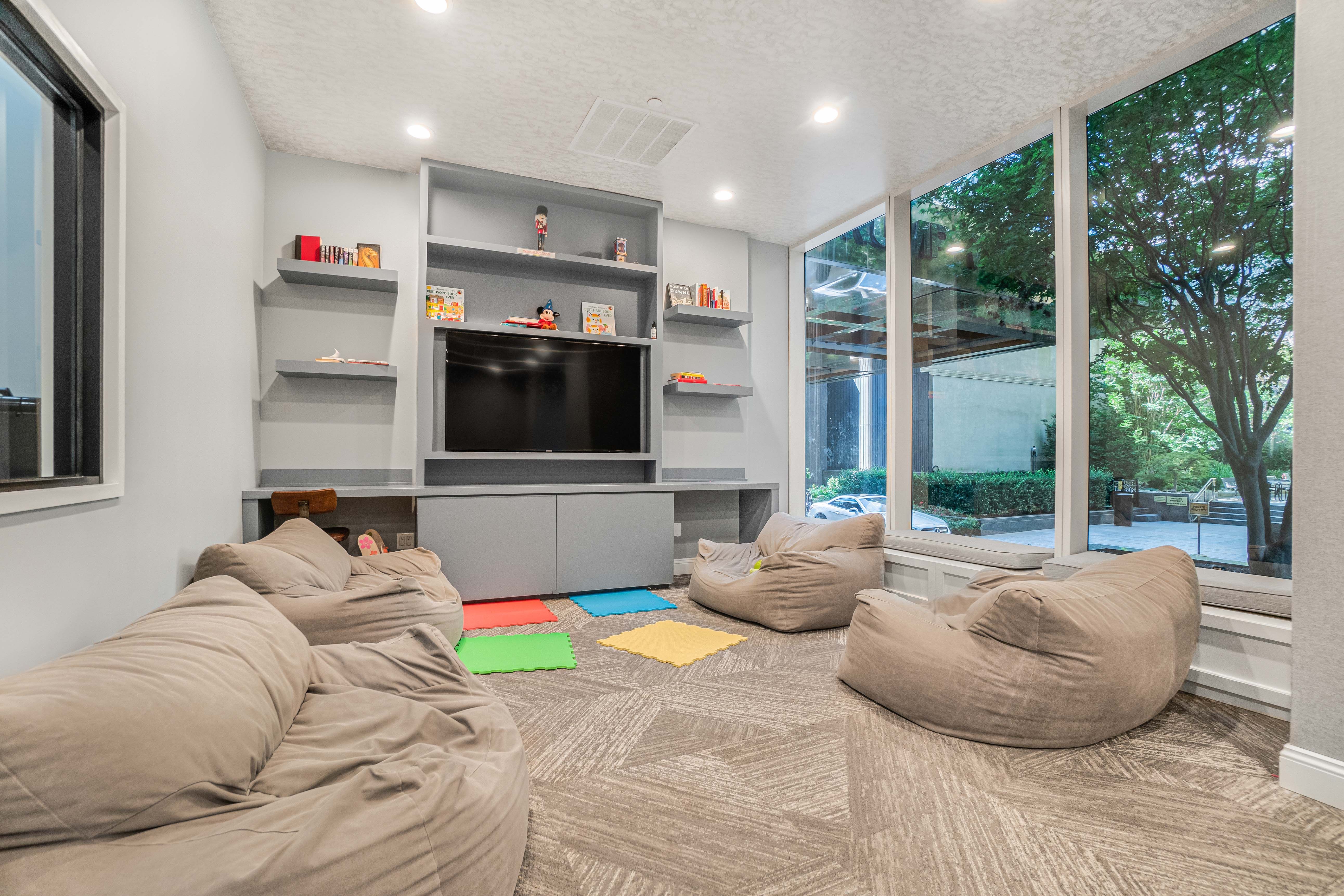 845 United Nations Plaza, Unit 5D Manhattan, NY 10017 - Photo 18 of 28 a living room with furniture and a flat screen tv