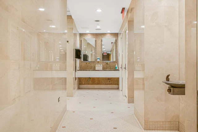 a bathroom with a sink a mirror and a bathtub