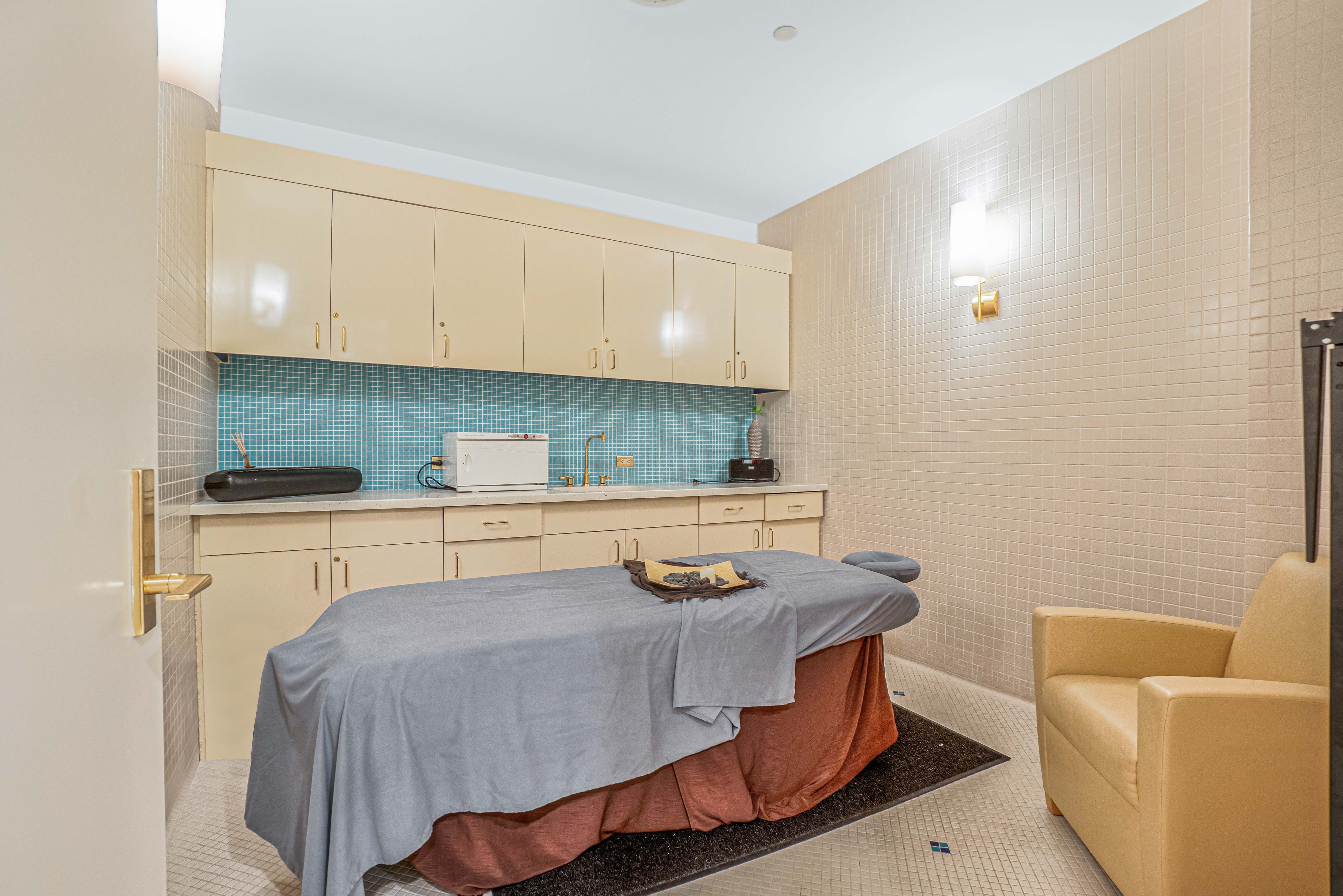845 United Nations Plaza, Unit 5D Manhattan, NY 10017 - Photo 25 of 28 a kitchen with stainless steel appliances granite countertop a sink stove and cabinets