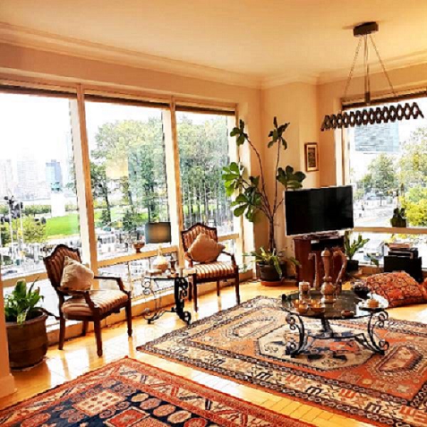 845 United Nations Plaza, Unit 5D Manhattan, NY 10017 - Photo 4 of 28 a living room with furniture large window and a flat screen tv