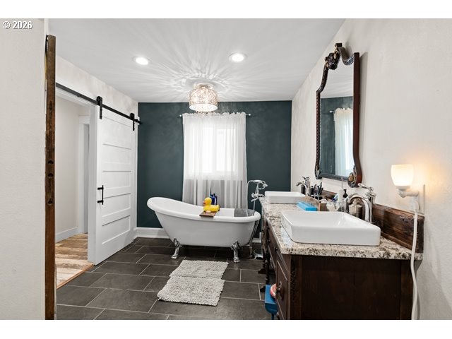 526 East Punkin Center Road Hermiston, OR 97838 - Photo 16 of 48 a bathroom with a sink mirror and a shower
