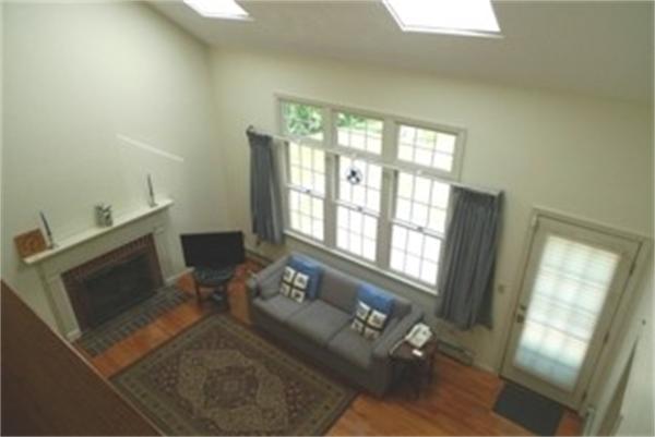 13 Nehemiah Road Shirley, MA 01464 - Photo 3 of 6 a living room with furniture and a fireplace