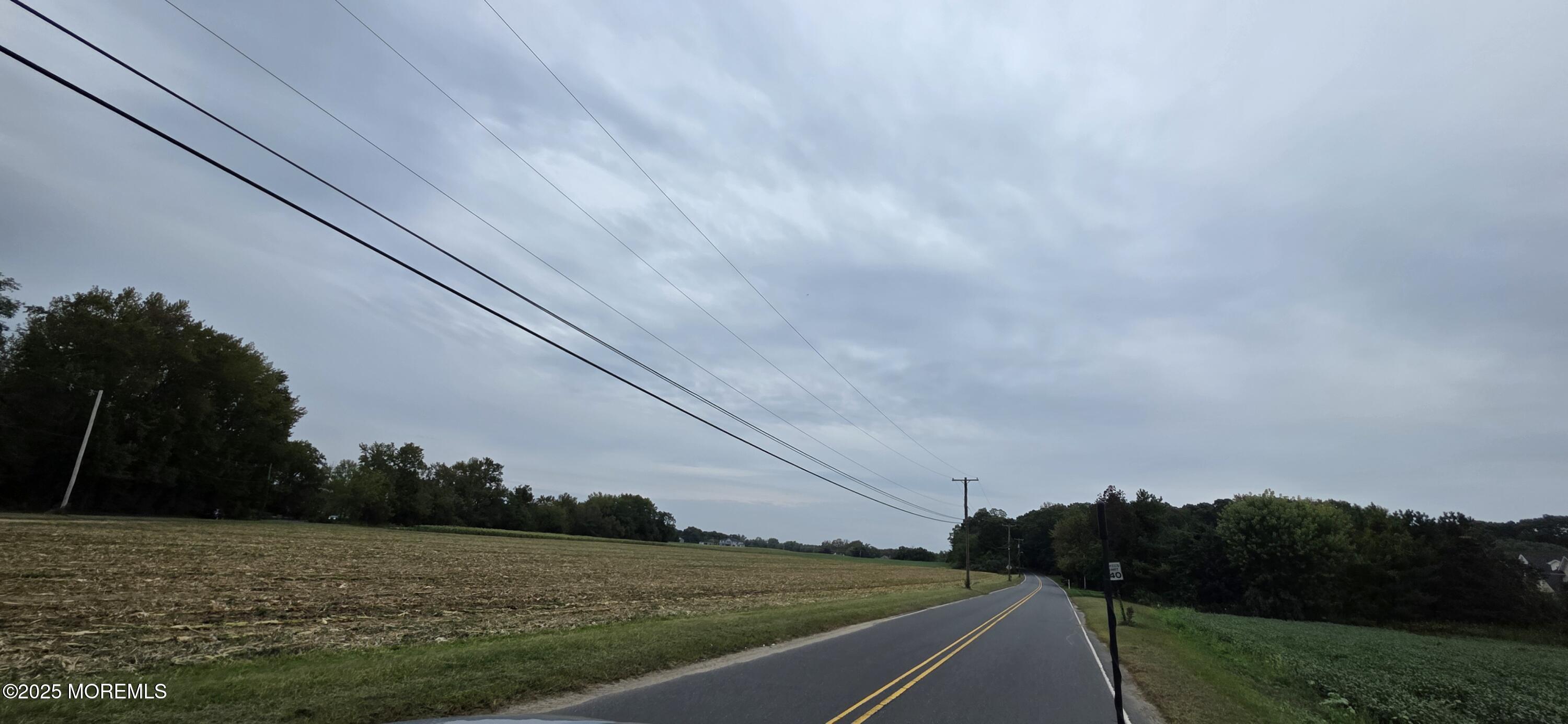 138 Howell Road Freehold, NJ 07728 - Photo 10 of 24 a view of a field with an ocean in background