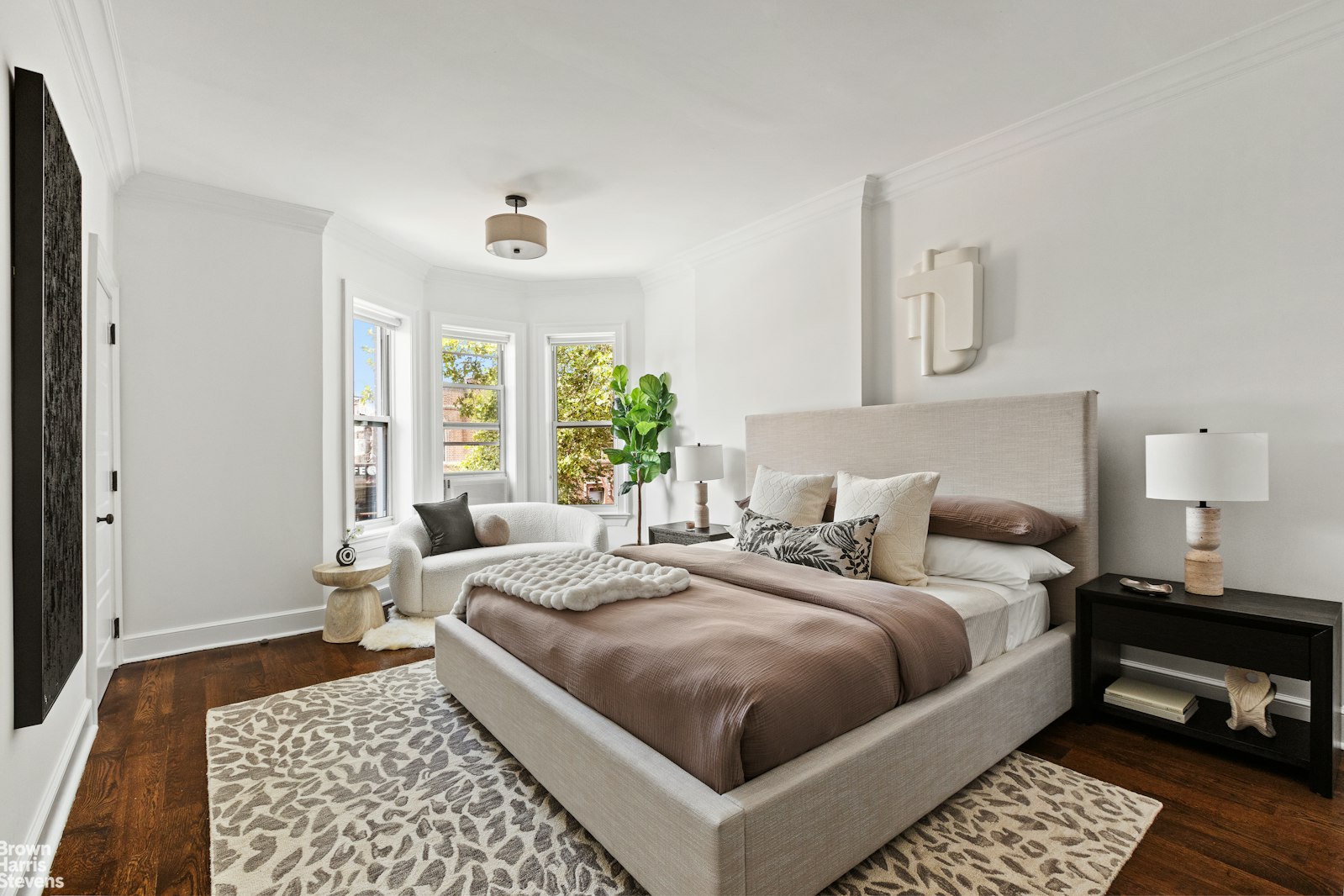 891 Knickerbocker Avenue Brooklyn, NY 11207 - Photo 5 of 12 a bedroom with a bed lamp and a window