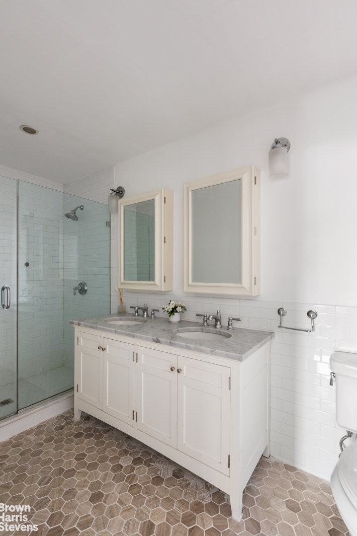 891 Knickerbocker Avenue Brooklyn, NY 11207 - Photo 6 of 12 a bathroom with a granite countertop sink and a mirror