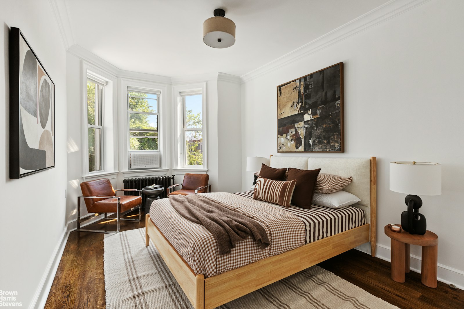 891 Knickerbocker Avenue Brooklyn, NY 11207 - Photo 7 of 12 a bedroom with a bed and a large window