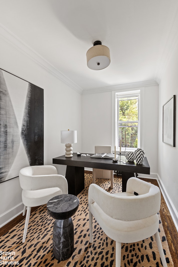 891 Knickerbocker Avenue Brooklyn, NY 11207 - Photo 8 of 12 a living room with furniture and a large window