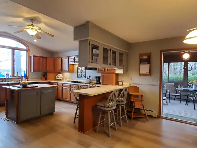 a view of a dining room with furniture and window