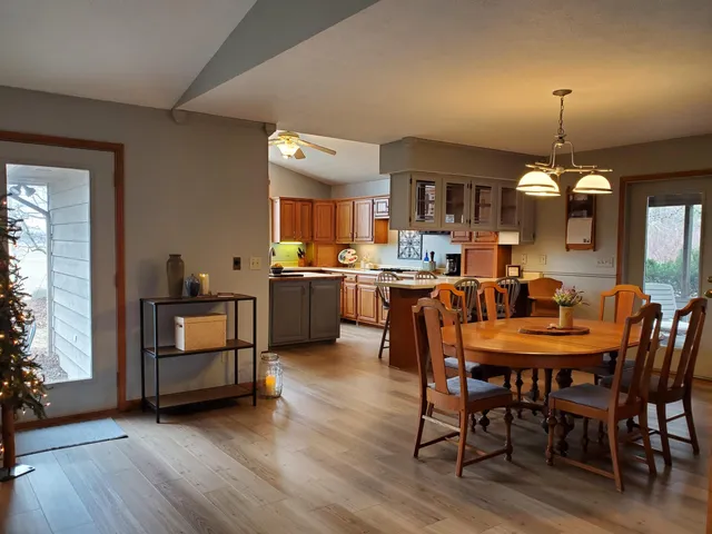 a view of a dining room with furniture and wooden floor