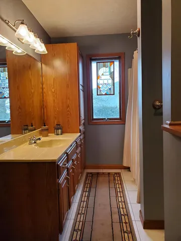 a kitchen with a sink cabinets and appliances