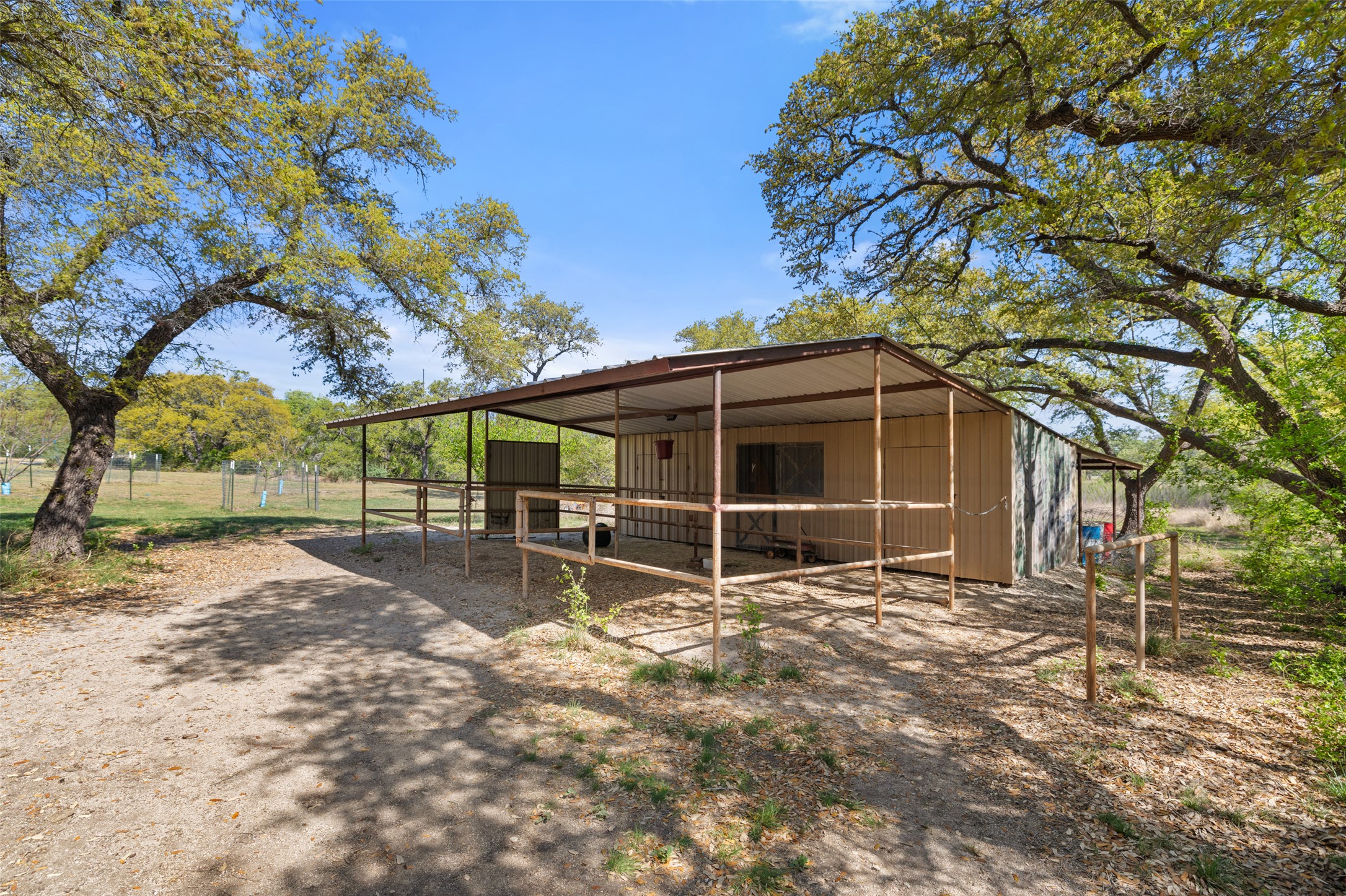 546 Lazy Oak Road Hye, TX 78635 - Photo 23 of 34 a view of a house with backyard and a tree