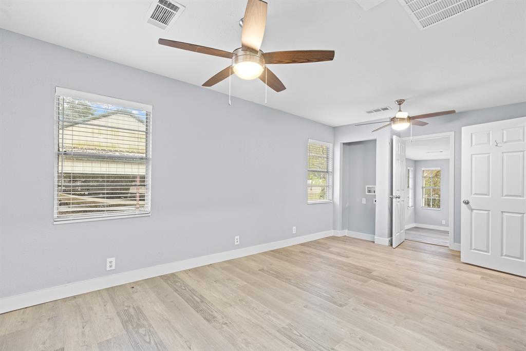 10474 Apache Street Wills Point, TX 75169 - Photo 15 of 29 a view of empty room with wooden floor and fan