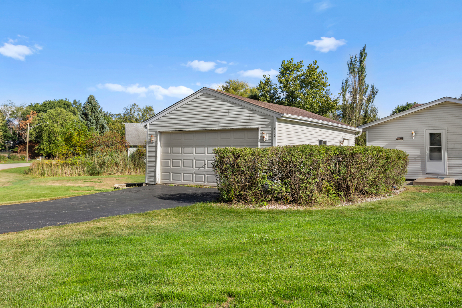215 Tollview Court Gilberts, IL 60136 - Photo 29 of 29 a view of a house with yard and a garden