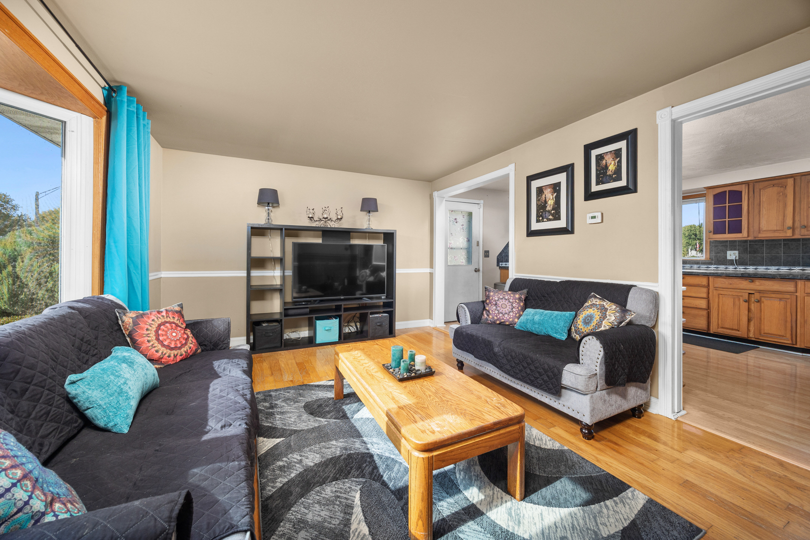 215 Tollview Court Gilberts, IL 60136 - Photo 5 of 29 a living room with furniture and a flat screen tv