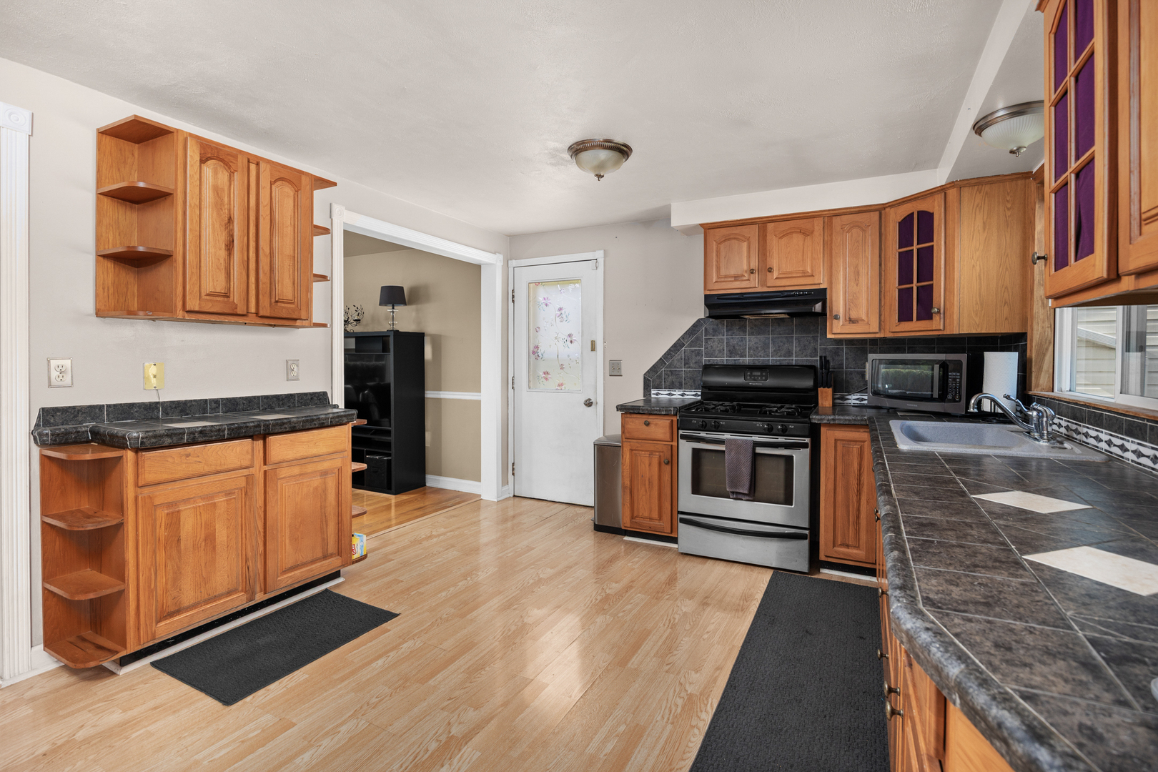 215 Tollview Court Gilberts, IL 60136 - Photo 10 of 29 a kitchen with stainless steel appliances granite countertop a stove a sink and a refrigerator