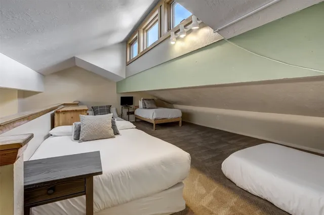 a bedroom with furniture and a chandelier