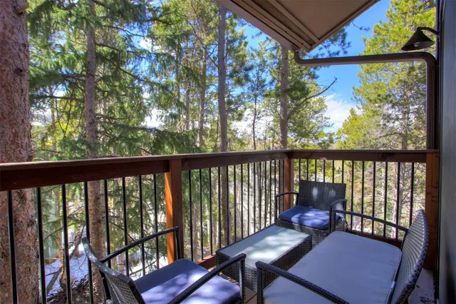 a view of a two chairs in the balcony