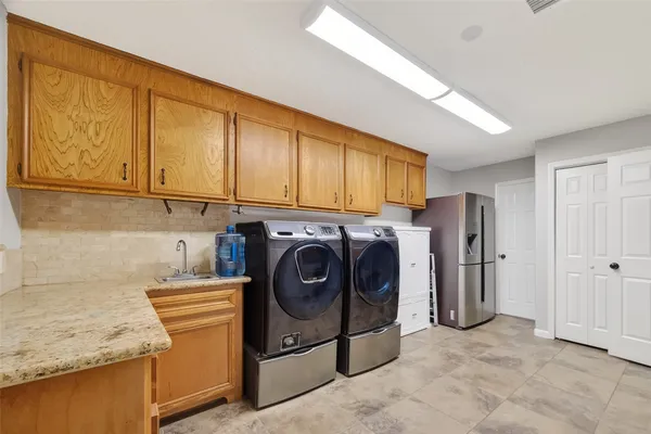 a utility room with dryer and washer