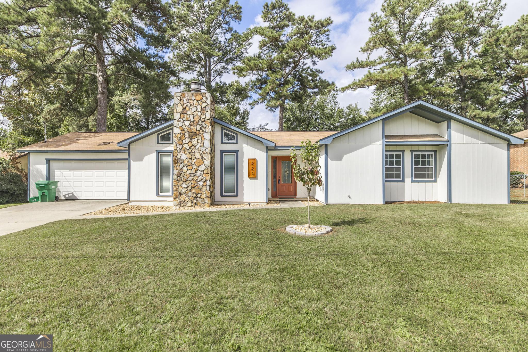 221 Gilchrist Drive Warner Robins, GA 31093 - Photo 1 of 33 a front view of a house with a garden