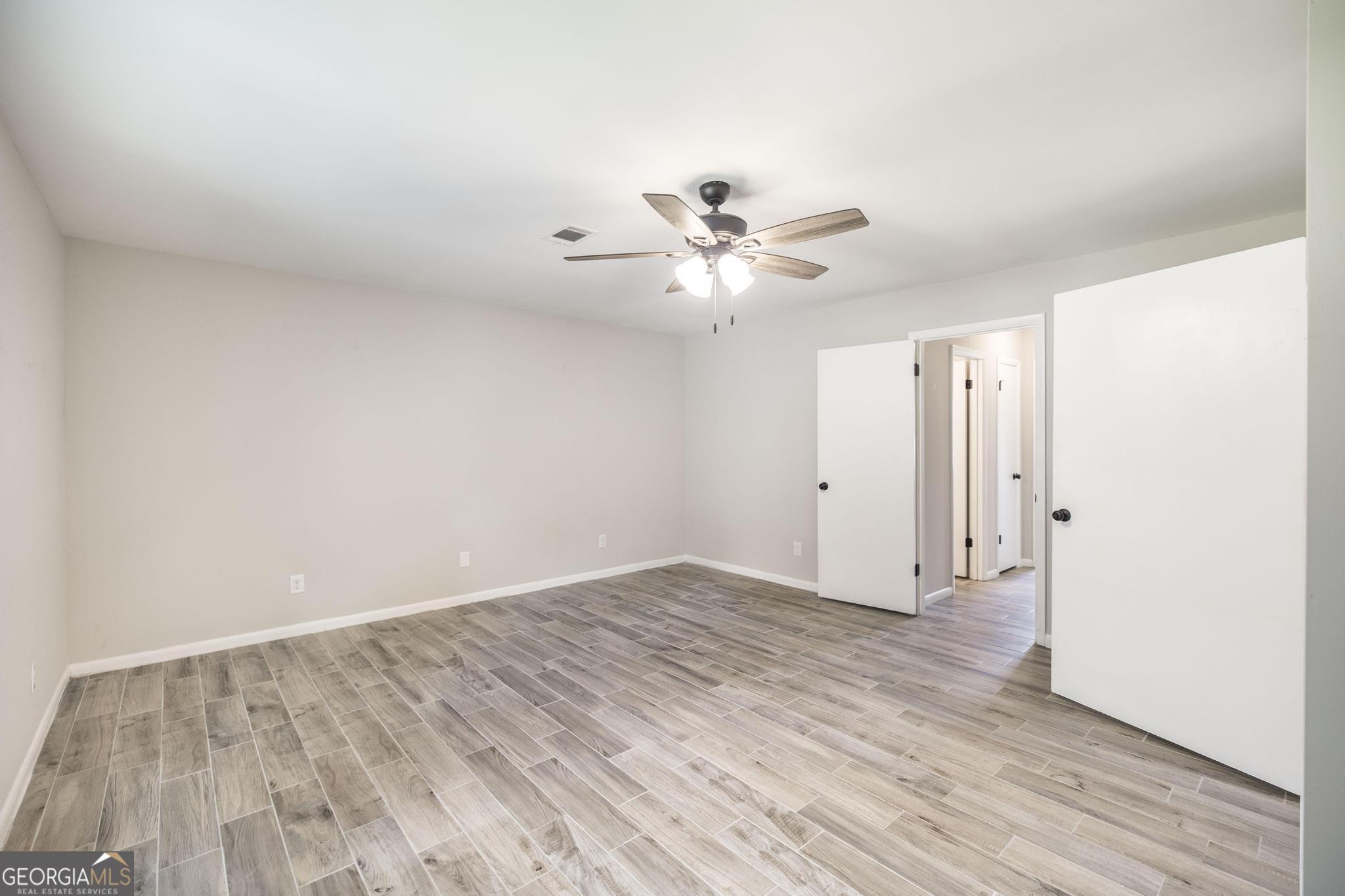 221 Gilchrist Drive Warner Robins, GA 31093 - Photo 22 of 33 wooden floor in an empty room