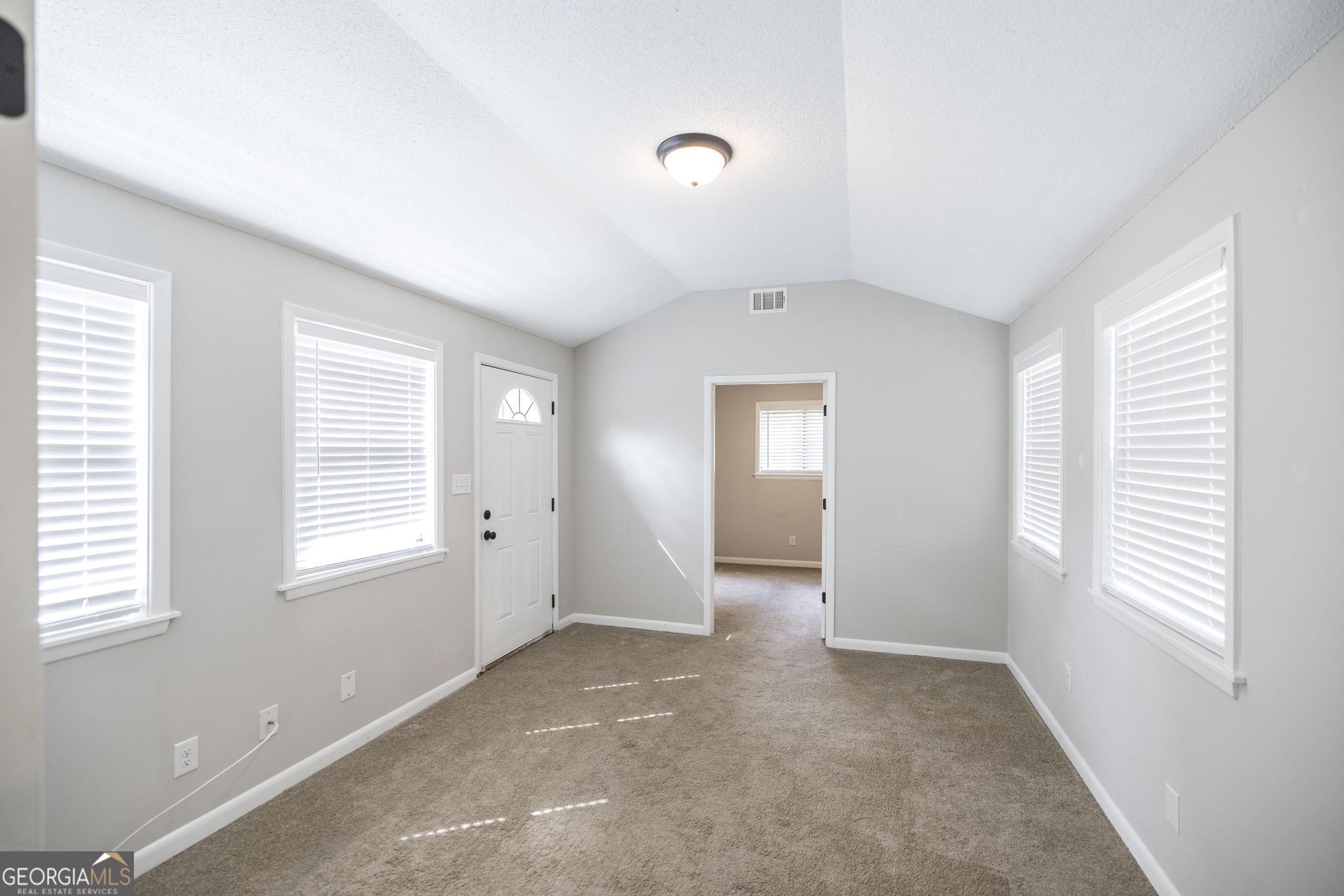 221 Gilchrist Drive Warner Robins, GA 31093 - Photo 26 of 33 a view of an empty room with a window