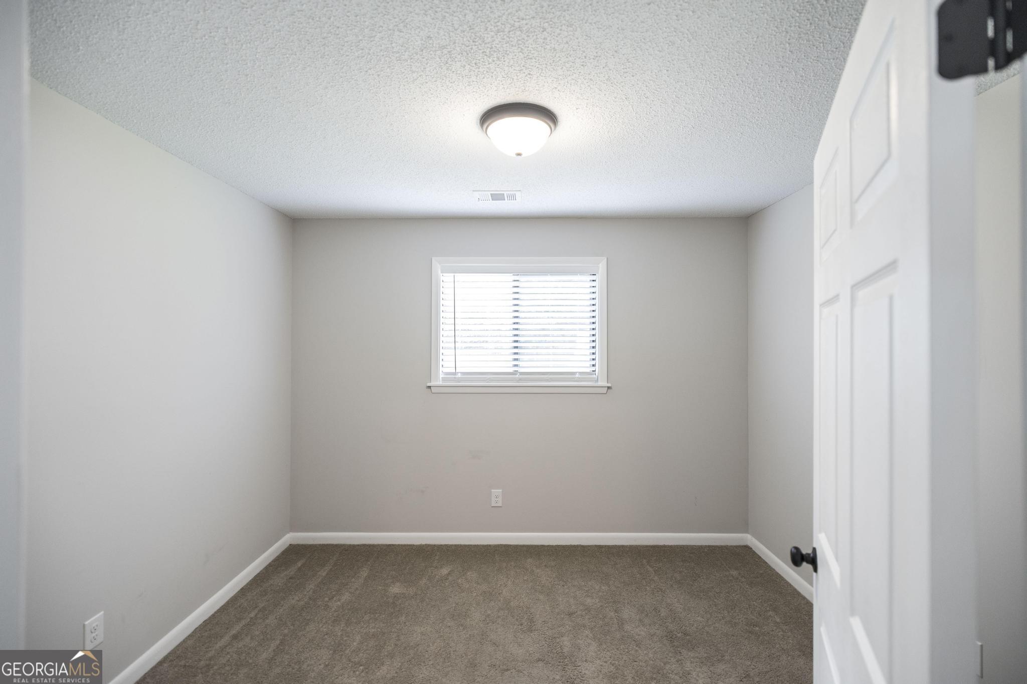 221 Gilchrist Drive Warner Robins, GA 31093 - Photo 27 of 33 an empty room with a window