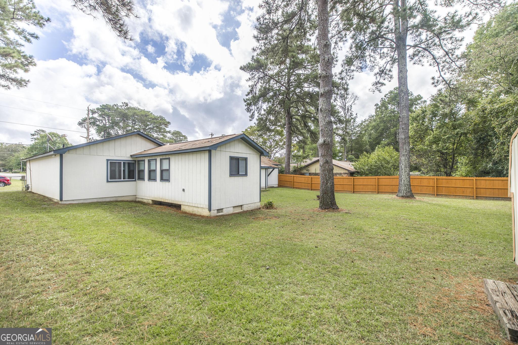 221 Gilchrist Drive Warner Robins, GA 31093 - Photo 30 of 33 a view of a house with backyard and tree